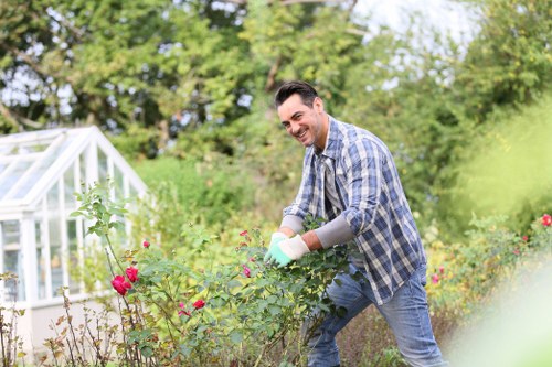 Garden waste and materials being handled during landscaping work